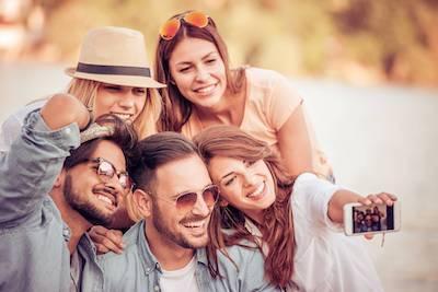 group of friends taking photo | teeth whitening rockville md