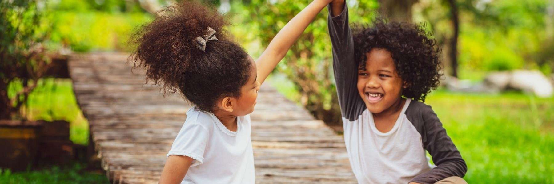 2 girls high fiving