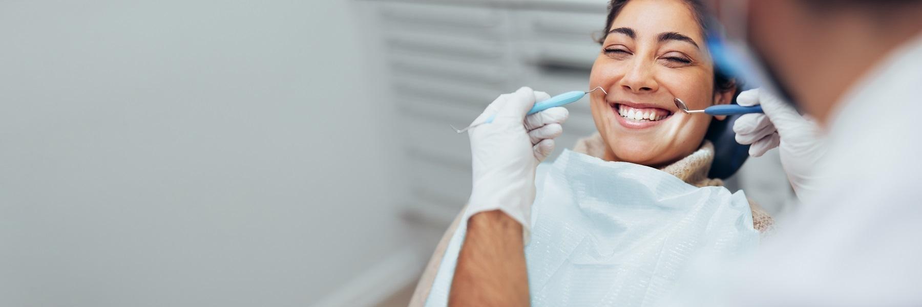 Woman in treatment chair at teeth whitening dentist near me Rockville, MD