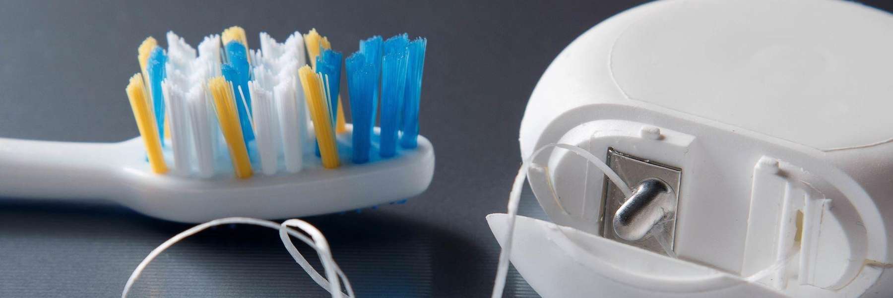 close up of toothbrush and floss | dentist shady grove road rockville md