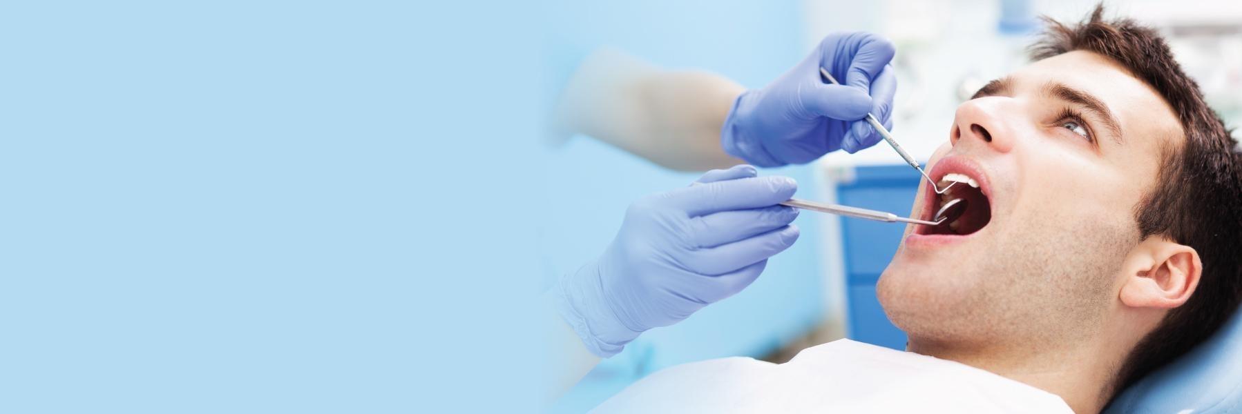 Man getting a teeth cleaning at dentist near me Rockville